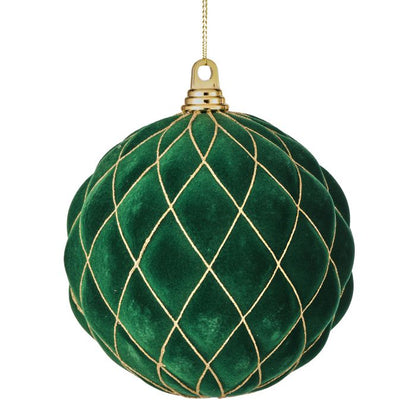 Green velvet ornament with gold lace pattern on a white background