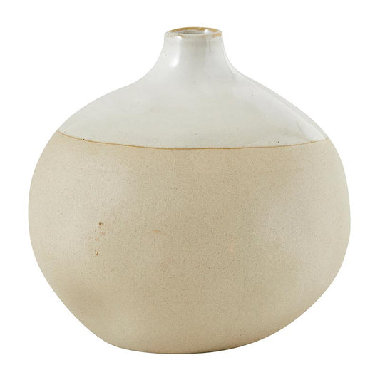 White ceramic vase with a textured surface on a white background